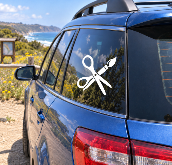 White scissors vinyl decal on car window
