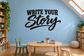 Black vinyl wall decal with “Write Your Story” lettering in bold script