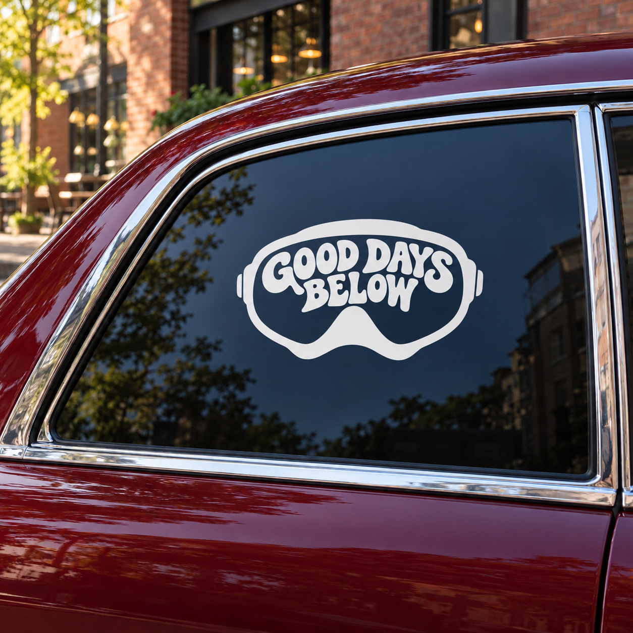 Scuba diving vinyl decal showing “GOOD DAYS BELOW” text in white on goggles shape