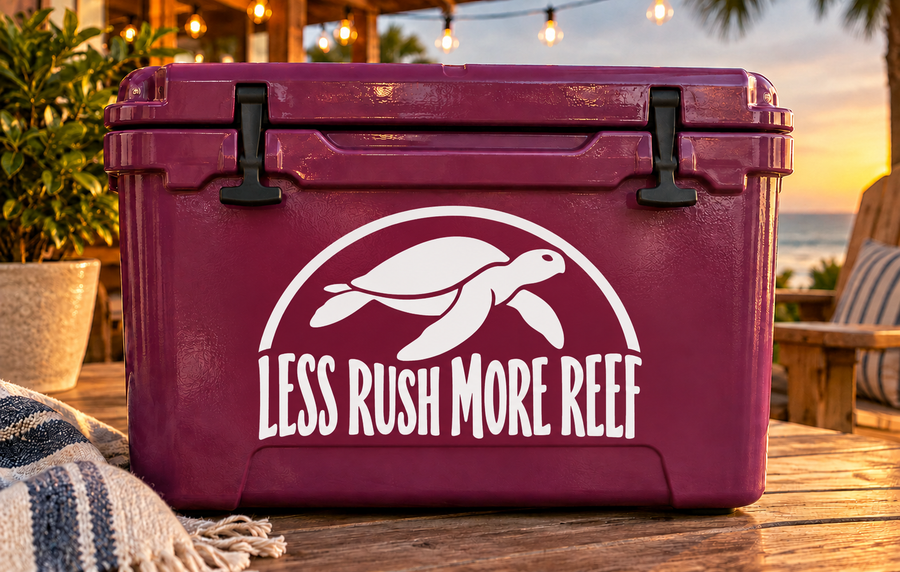 White turtle vinyl decal reading 'LESS RUSH MORE REEF' on purple cooler