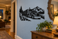 Logging truck mountain route vinyl decal with black silhouette on an indoor wall