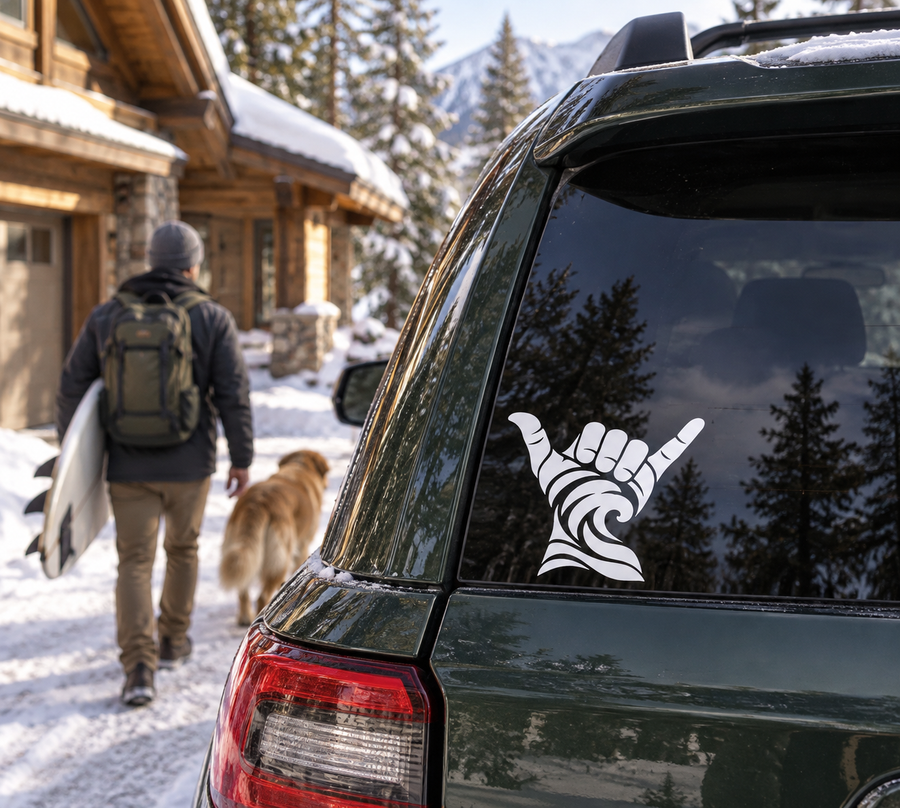 Shaka vinyl decal with wave sleeve on car rear window, black and white hand