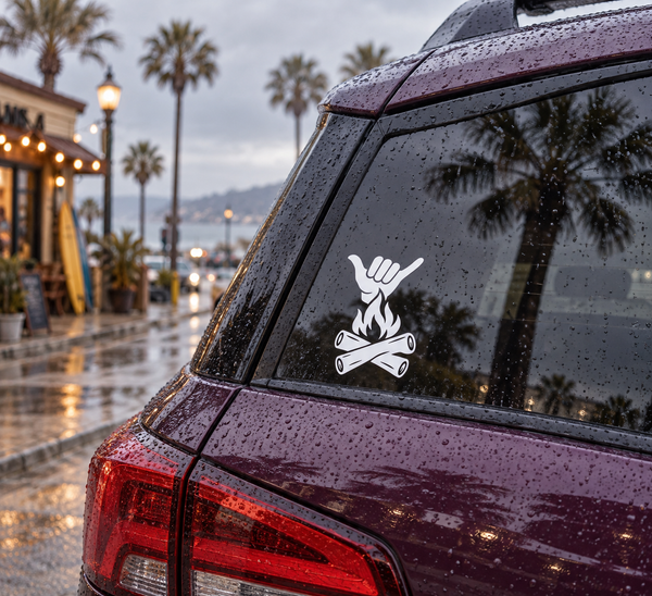 Campfire Shaka vinyl decal with white shaka hand above campfire on car window