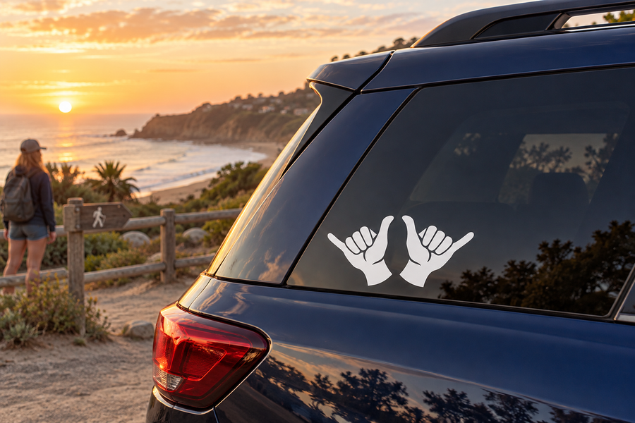 Vinyl shaka hand decal on car rear window, two white hand symbols