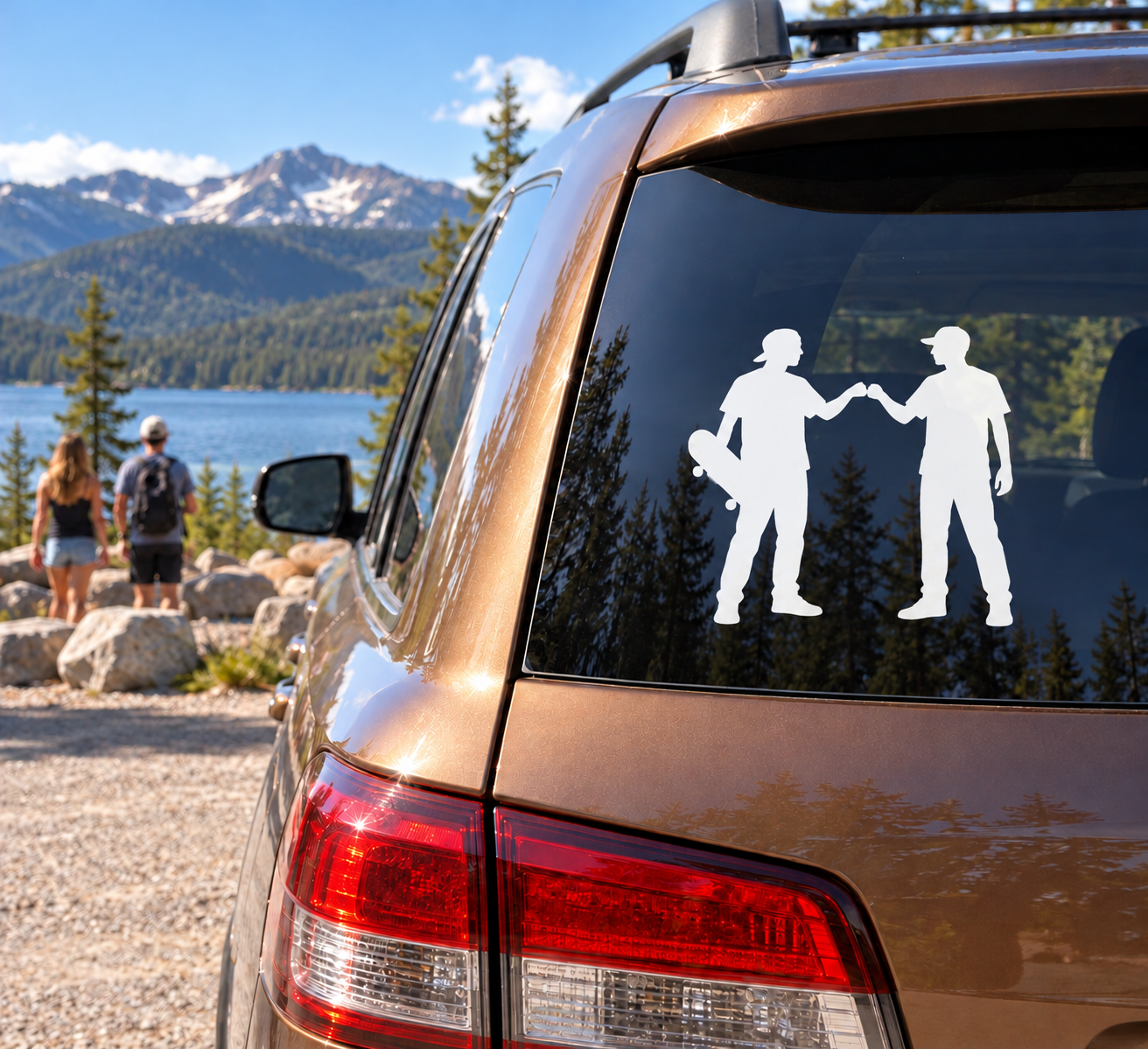 White skateboard-friend silhouettes vinyl decal on car window, two people holding skateboards