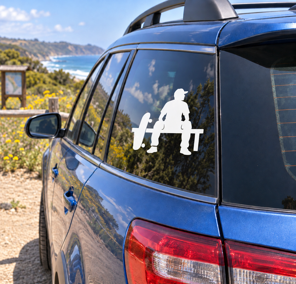 Skateboarding bench vinyl decal on car window, white skater silhouette with skateboard.