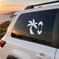 Skateboarding vinyl car decal with white palm tree and “0” on dark window