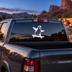 Skateboarding penguin vinyl decal, white penguin riding a skateboard graphic
