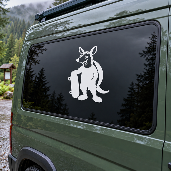 Vinyl decal of white cartoon armadillo with skateboard on dark vehicle window