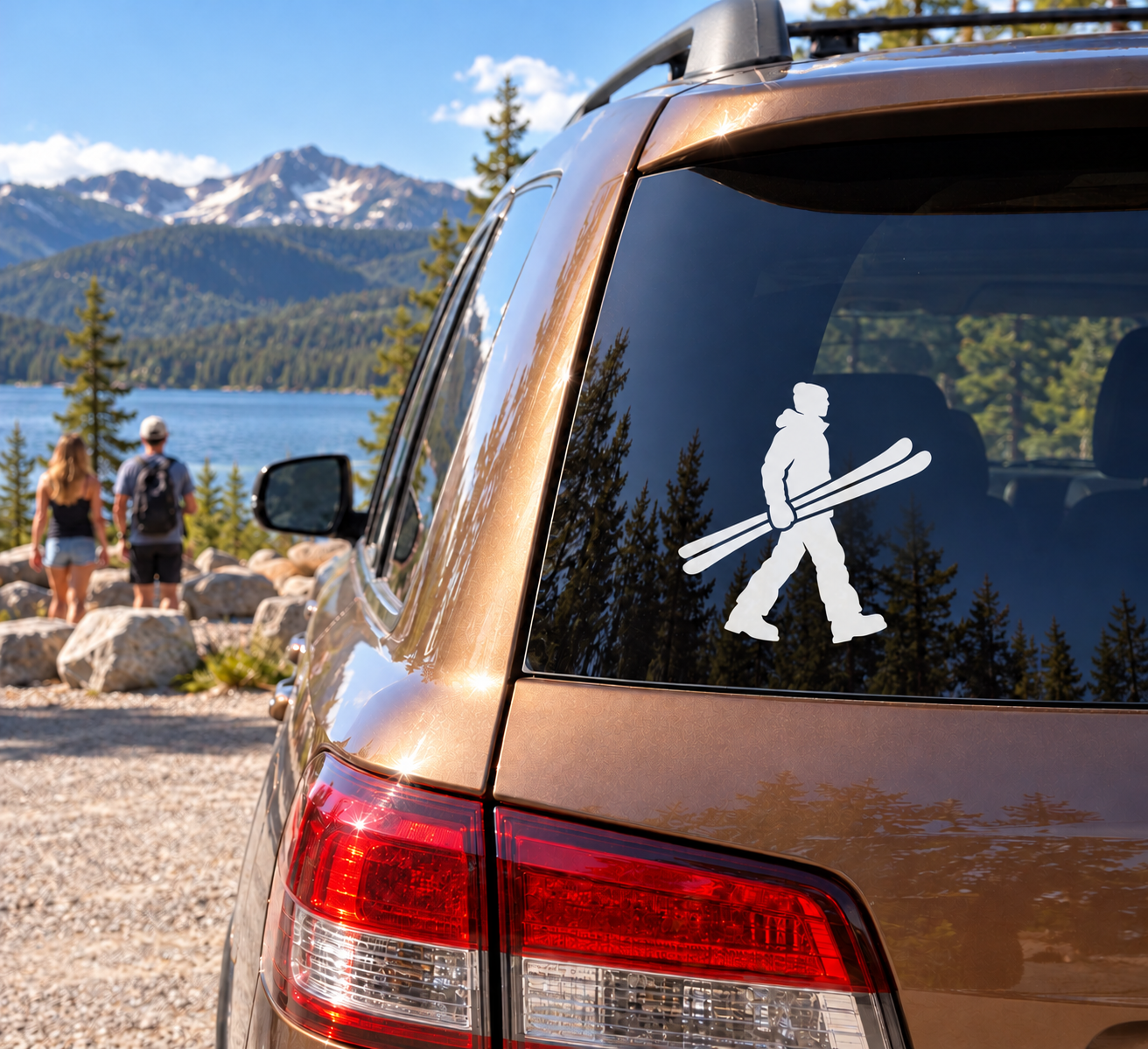 Skiing vinyl decal of a person walking with skis on a car window