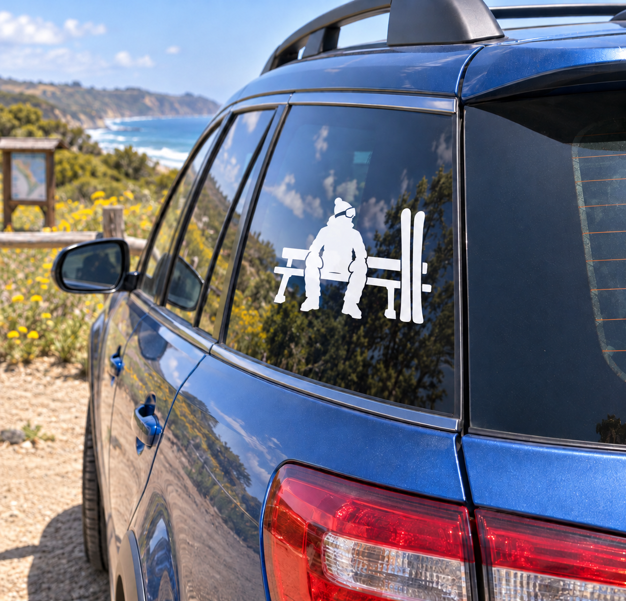 White skier silhouette vinyl decal on car window with bench and ski poles