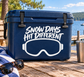 Blue cooler with white skiing goggles vinyl decal reading 'Snow Days Hit Different'