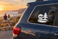 Skull and pine horizon vinyl decal on car rear window, white design