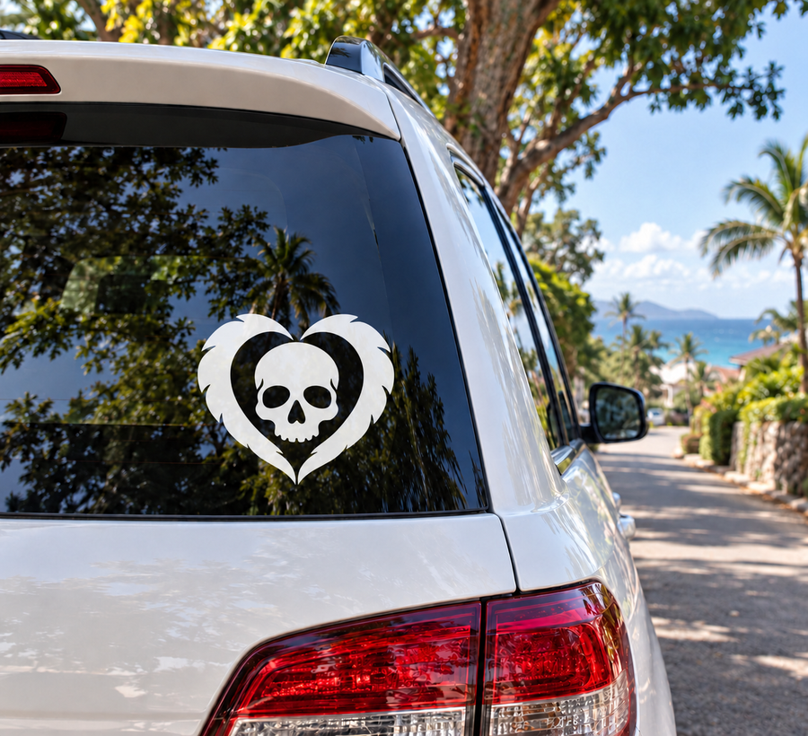 Skull and feather heart vinyl decal in black and white on car window