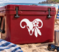 White skull ram and blossom vinyl decal on red surface