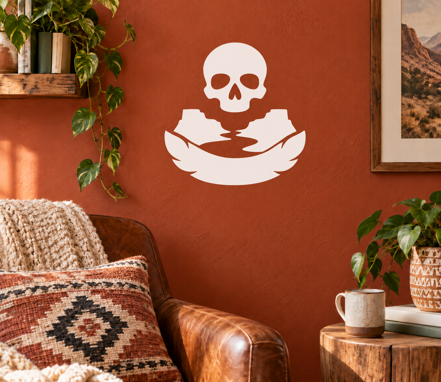 Skull and feather vinyl decal, white silhouette on a surface