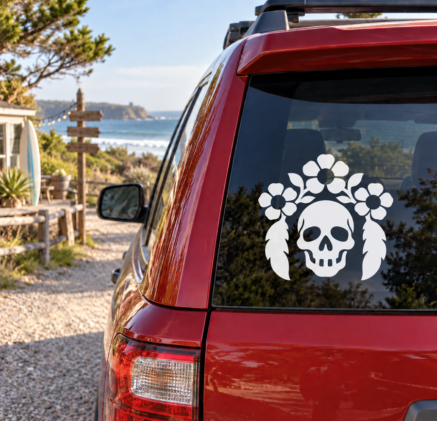 Skull botanical vinyl decal with white skull and floral leaf plumes on car rear window