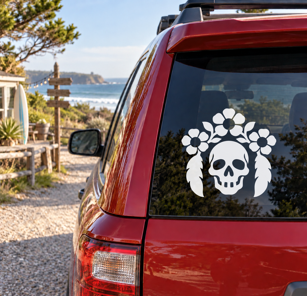 Skull botanical vinyl decal with white skull and floral leaf plumes on car rear window
