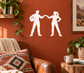Vinyl wall decal of two partner silhouettes holding hands, white cutout
