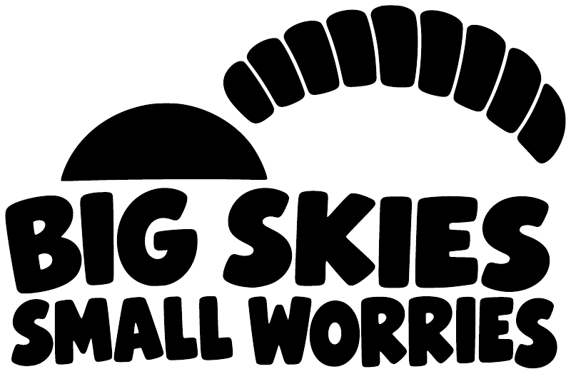 Vinyl decal graphic: handprint arc above bold Big Skies Small Worries lettering