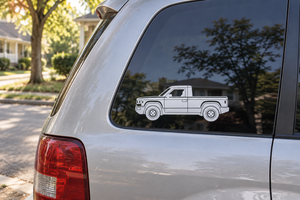 White truck side profile vinyl decal on car window, outlined pickup design