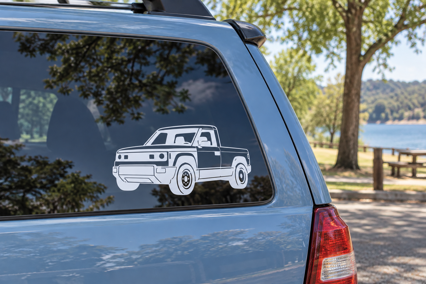 Vinyl truck decal with low front angle outline, white on dark car window