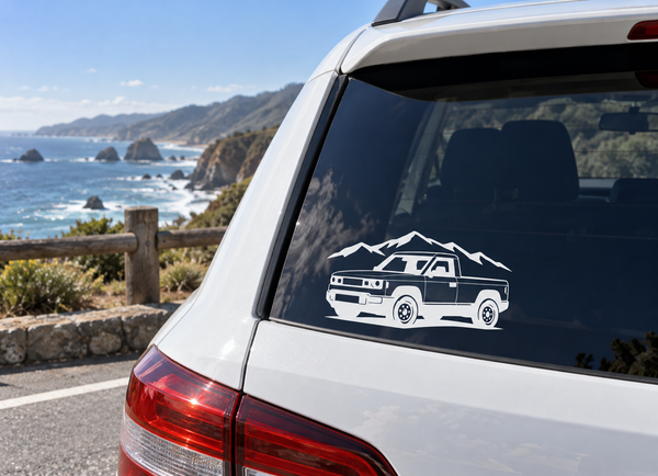 Vinyl truck decal of a white van with mountain road line art on rear window