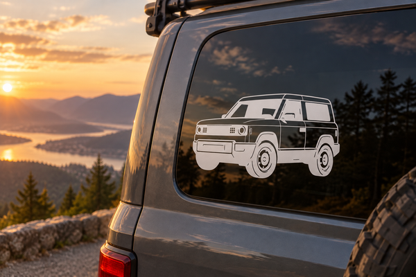Slate-colored SUV vinyl decal on vehicle rear window, low front angle design.