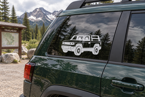 Truck vinyl decal graphic on dark green vehicle side window, front three-quarter view
