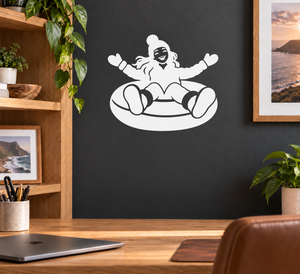 White sledding snow tube vinyl decal with smiling rider on inner tube