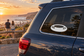 Sledding snow tube vinyl decal on a vehicle rear window, black and white design