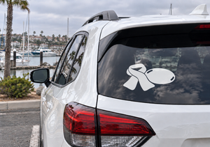 Sledding vinyl decal on car rear window, white sled and skates design