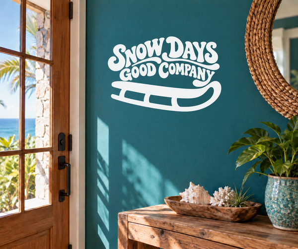 White Snow Days Good Company vinyl sledding decal on teal wall