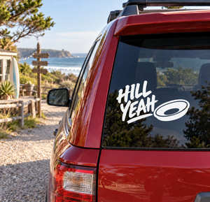 Vinyl decal on car glass: 'Hill Yeah' white lettering with oval logo