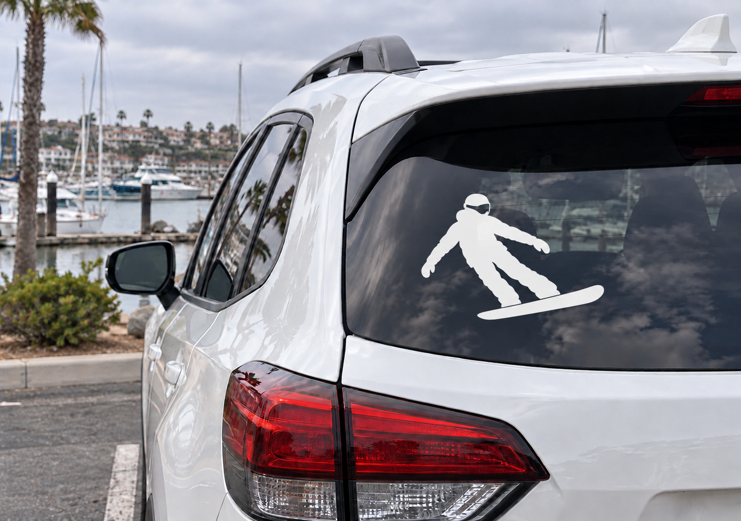 Snowboarding vinyl decal of snowboarder on car rear window