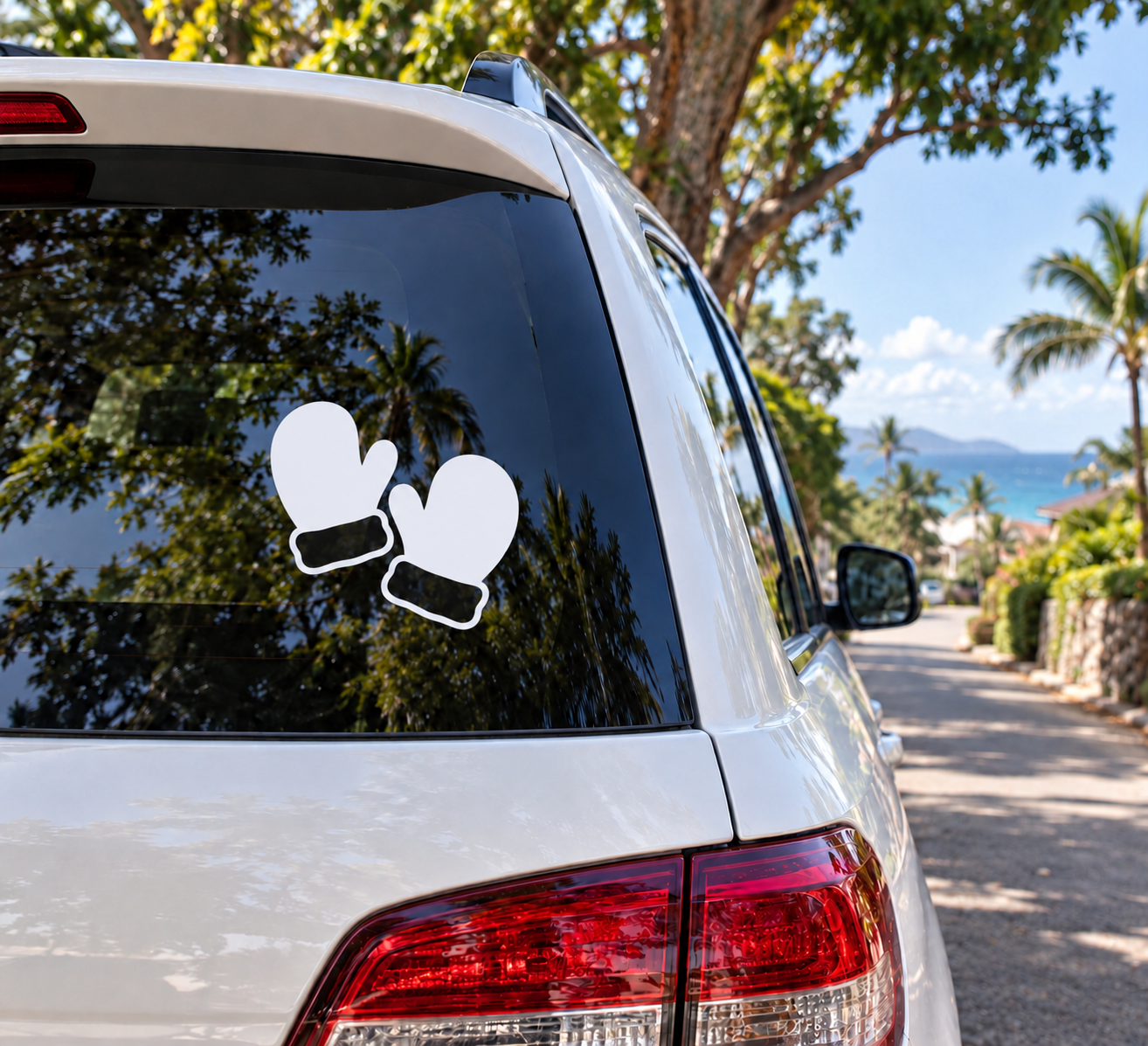 Vinyl mitten decal pair on car window, white snowboard glove shapes