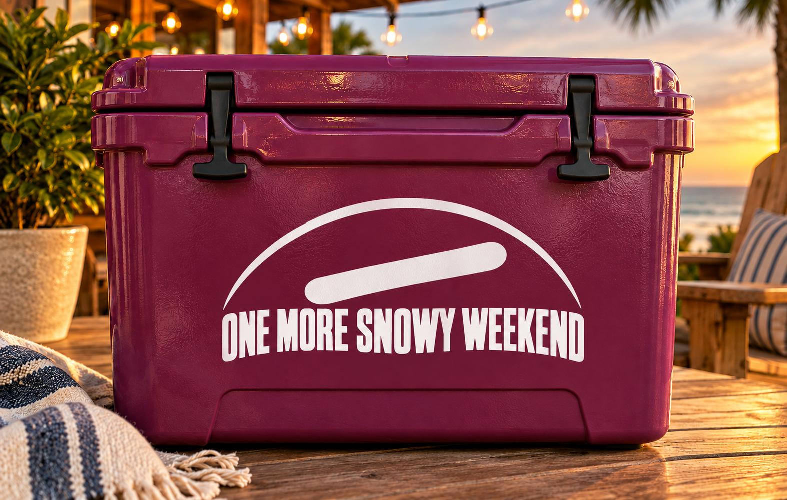 Maroon vinyl decal on rectangular case, 'ONE MORE SNOWY WEEKEND' in white