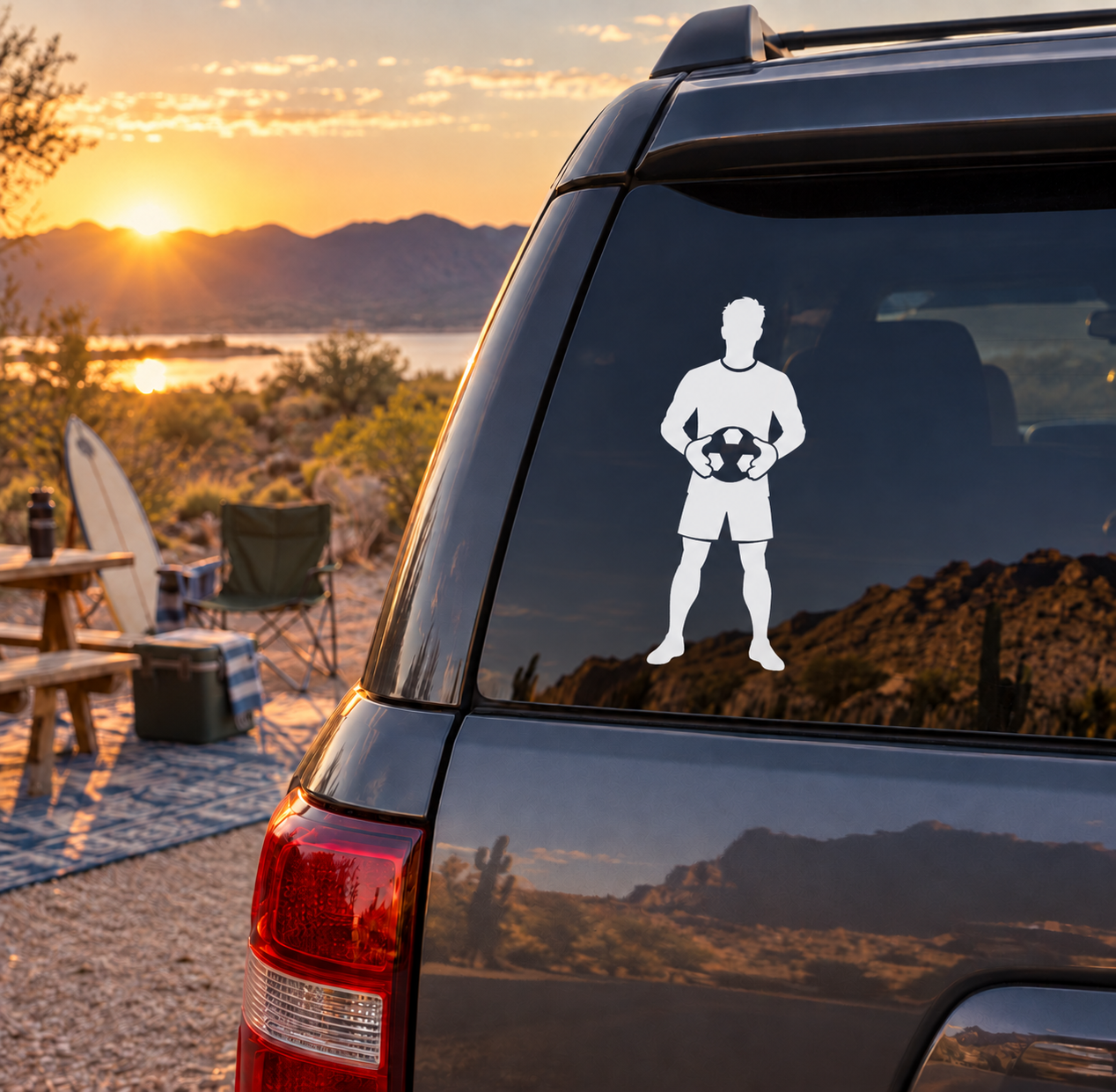 Soccer goalkeeper vinyl decal of player holding a soccer ball on a car window
