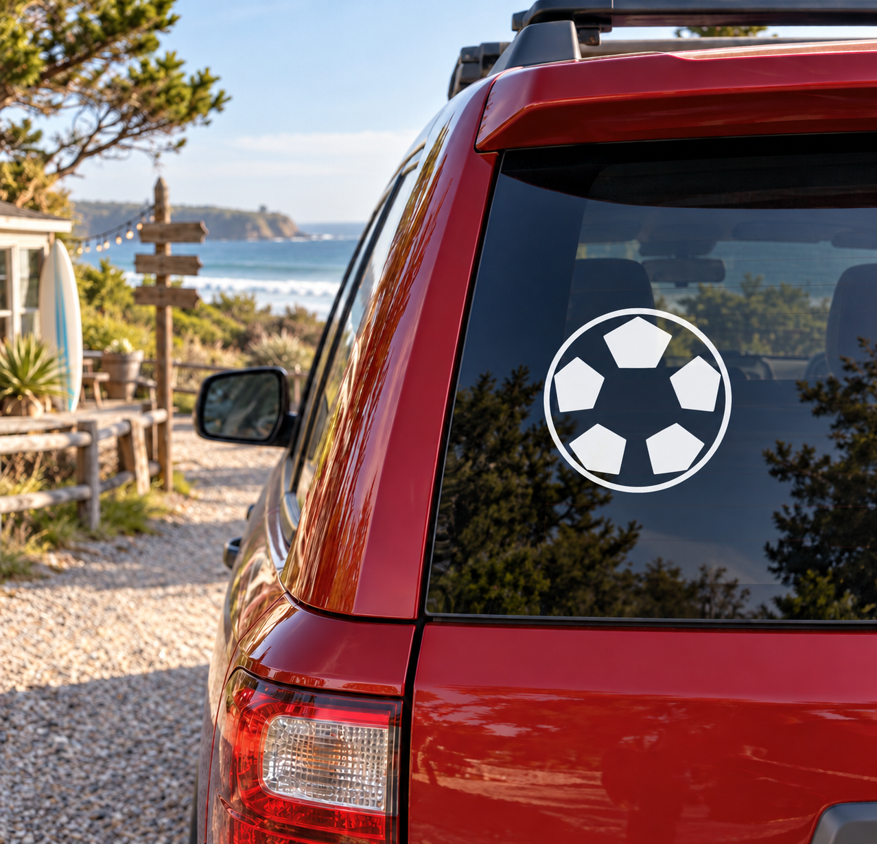 Soccer ball vinyl decal on car window, white circle with black pentagon panels