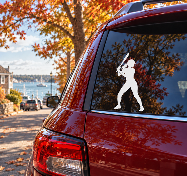 Softball player vinyl decal on car window, swinging bat in a ready stance