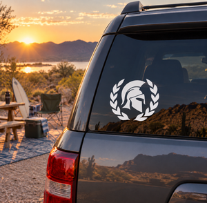 Vinyl decal of white laurel wreath and Spartan helmet on car rear window