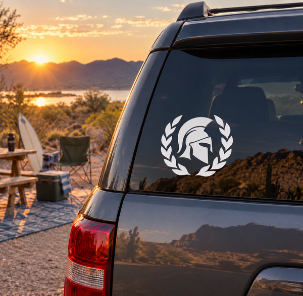 Vinyl decal of white laurel wreath and Spartan helmet on car rear window