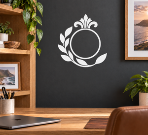 White laurel wreath vinyl decal with circular center and shield-style emblem