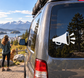 White vinyl megaphone decal with black outline and three black sound waves on car window