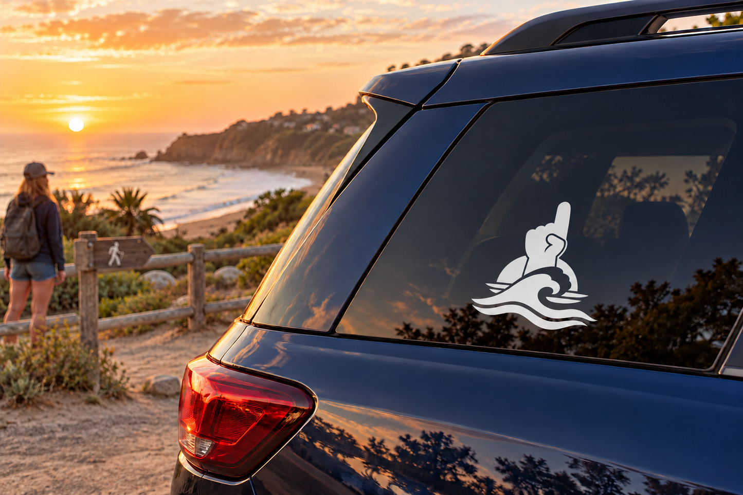 White cheer vinyl decal on a car rear window with raised arm over wave lines