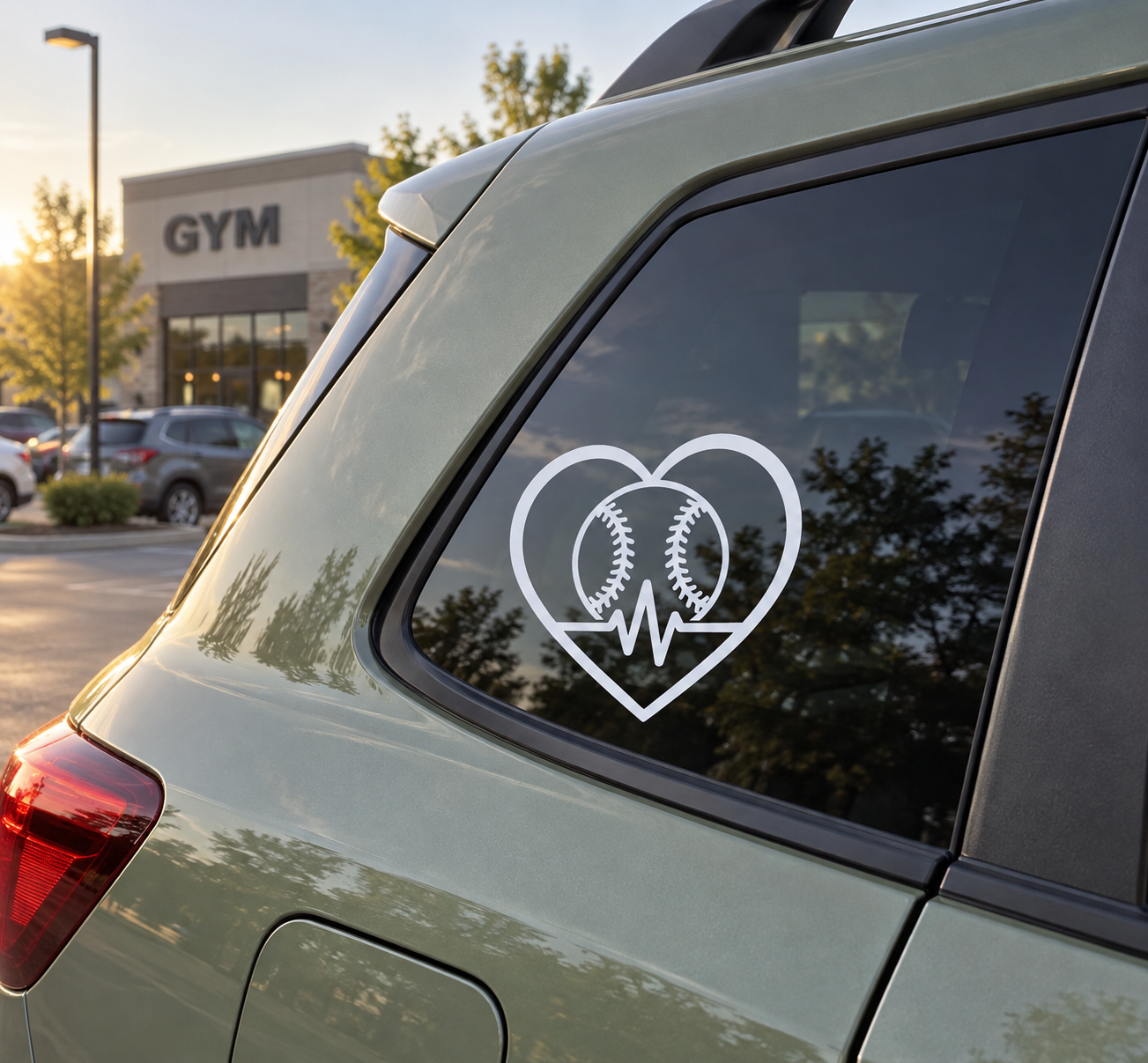 Baseball heart vinyl decal on car window, white outline with two baseballs and heartbeat line