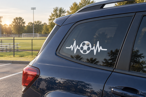 Soccer pulse line vinyl decal on car rear window: white heartbeat with soccer ball.