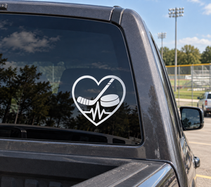 Car window vinyl decal: heart with hockey stick, puck, and heartbeat line