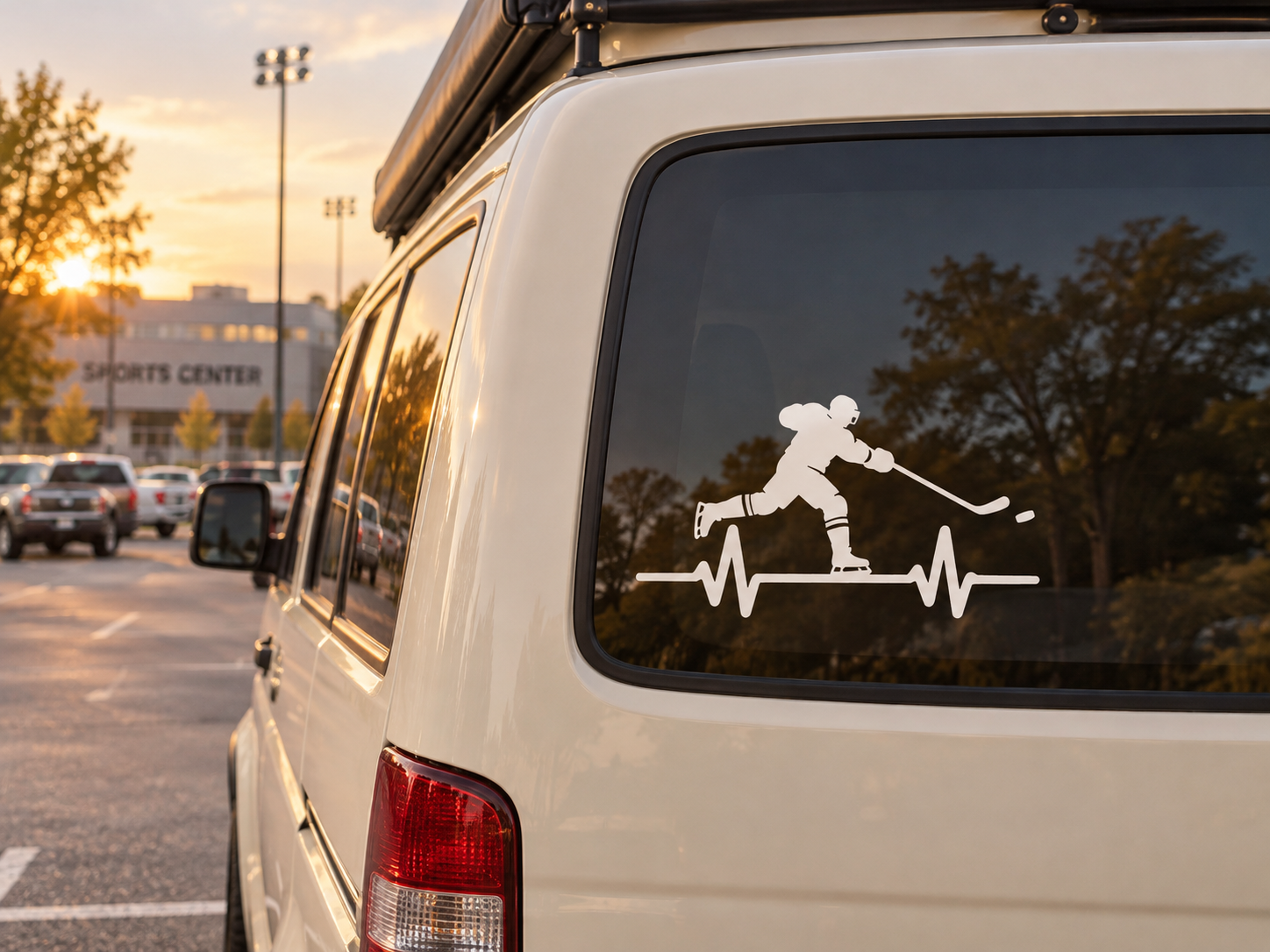 Hockey pulse vinyl decal on car window, black player silhouette with stick and heartbeat line