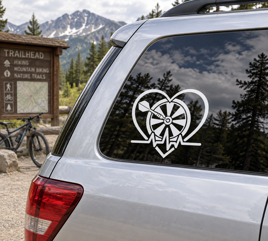 Heart-shaped vinyl decal with dartboard and dart on car rear window